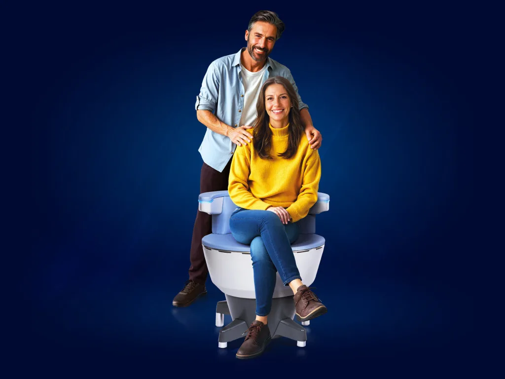 Patient sitting on Emsella chair for pelvic floor treatment